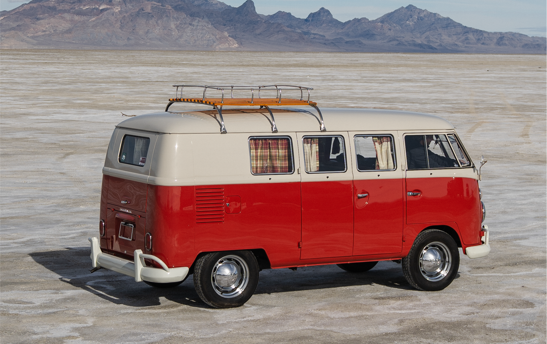 Vanlife 1963 VW Kombi Camper van parked on open plains with mountains in the background
