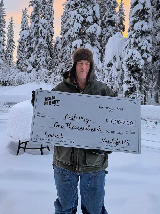 Dennis B holding a check for $1000