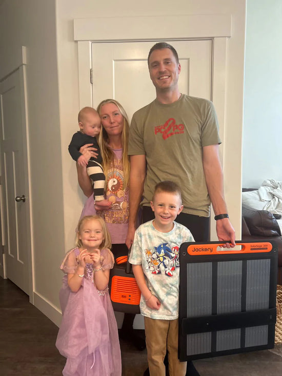 VanLife Jackery Solar Generator Winner celebrates with his family.